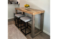 Handcrafted in Arizona, this reclaimed wood bar-height table showcases enduring quality and sustainable craftsmanship. Paired with three cushioned stools with black steel frames, it's ideal as a narrow kitchen island or restaurant table.