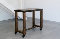 This handcrafted Sequoia reclaimed wood bar-height table blends timeless craftsmanship and sustainable materials. Perfect as a kitchen island, narrow dining table, or restaurant table, it boasts sturdy legs and caster wheels.