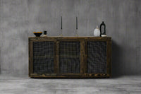 Experience timeless craftsmanship with this handcrafted reclaimed wood sideboard, featuring mesh-front doors—perfect as a bar table or narrow dining table. Accented by artisan decor, it’s sustainably made for enduring quality.