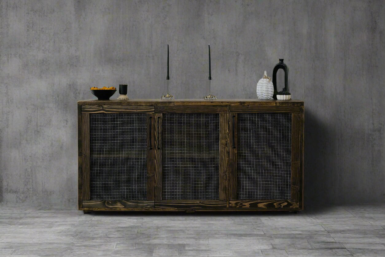 Experience timeless craftsmanship with this handcrafted reclaimed wood sideboard, featuring mesh-front doors—perfect as a bar table or narrow dining table. Accented by artisan decor, it’s sustainably made for enduring quality.