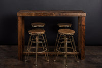 Handcrafted in Arizona, this bar-height Sequoia table is made from reclaimed wood and paired with four round stools with sturdy steel legs. A statement of lasting quality, ideal as a bar table or kitchen island. Custom sizes offered.