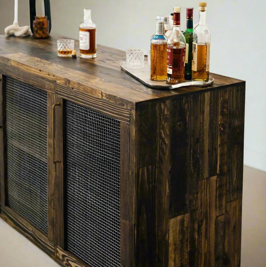 Experience enduring quality with this handcrafted reclaimed wood bar cart, featuring wire mesh doors and artisan detailing. Ideal as a bar table or kitchen island, it’s perfect for any cozy home or restaurant setting.