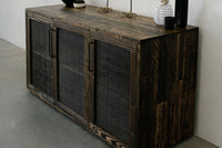 This handcrafted reclaimed wood sideboard features mesh panel doors and sleek black handles, beautifully showcasing sustainable craftsmanship. Ideal as a narrow bar table or counter-height reclaimed wood furniture centerpiece.