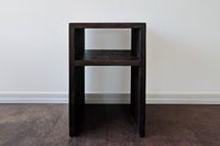 Handcrafted in Arizona, this narrow side table showcases enduring quality with its waterfall design and open shelf. Made from reclaimed wood, it's ideal as a sustainable bar-height table or accent for kitchens and restaurants.