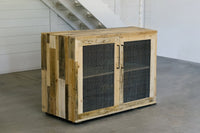 This handcrafted reclaimed wood sideboard features durable mesh wire doors and sleek black handles. Perfect for modern spaces, it’s a standout piece of sustainable reclaimed wood furniture built to last.