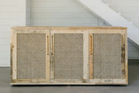 Expertly crafted from reclaimed wood, this sideboard features three woven rattan doors and offers a timeless addition to any space. Ideal as a narrow bar table or dining storage, its minimalist design highlights enduring quality.