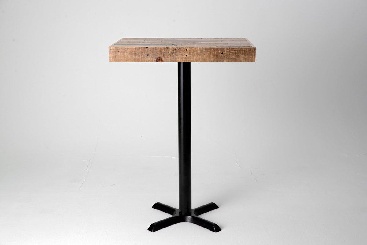 Handcrafted in Arizona, this bar-height dining table features a robust reclaimed wood top and a sturdy black steel pedestal base. Ideal as a kitchen island or restaurant table, its enduring quality suits any modern space.