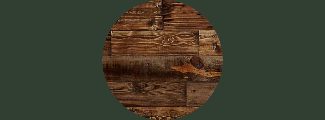Circular image of reclaimed wood planks with varied textures and grain patterns, highlighting rustic craftsmanship and sustainable materials; set against a solid dark green background.