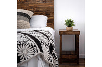 This inviting bedroom showcases a handcrafted reclaimed wood headboard and Arizona-made nightstand, highlighting artisanal woodworking. Natural finishes, sustainable materials, and enduring quality define this refined furniture piece.