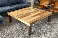 This handcrafted reclaimed wood coffee table showcases light and dark stripes, bringing enduring quality and sustainable style to a modern living room. Ideal as centerpiece reclaimed wood furniture for home or hospitality spaces.