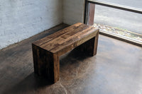 Experience timeless design with this handcrafted reclaimed wood bench, expertly finished in a rich dark tone. Ideal as a narrow dining table or restaurant table, it highlights sustainable materials and artisan quality for enduring appeal.