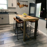Reclaimed wood kitchen island in modern airbnb