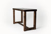 Minimalist rectangle coffee table featuring a rectangular top and geometric open-frame legs, handcrafted in Arizona from dark polished reclaimed wood, displayed on a plain white background.
