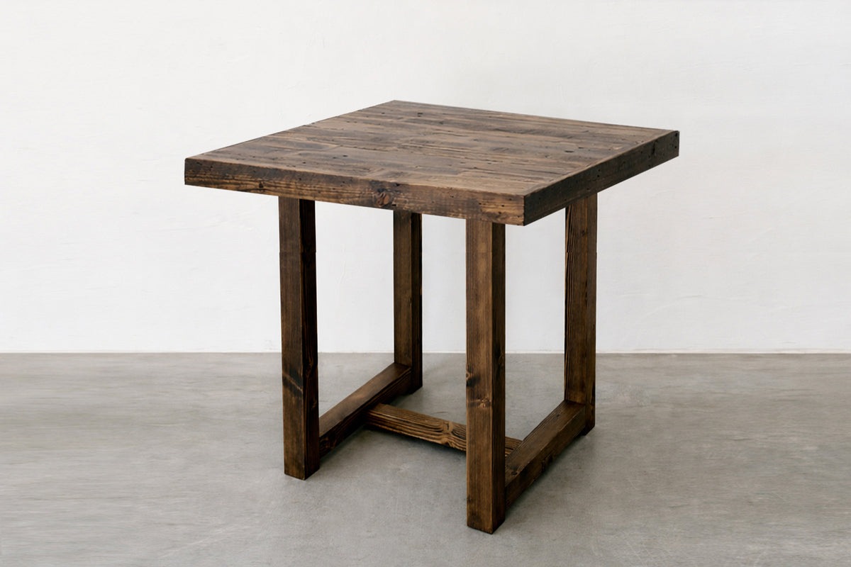 This handcrafted, square bar height high top table showcases a warm, rustic design with a thick reclaimed wood top and sturdy legs. Sustainable quality built to last.
