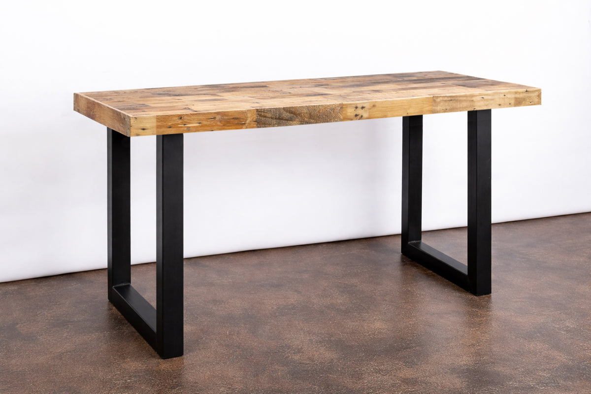Handcrafted in Arizona, this reclaimed wood bar-height table showcases a natural patchwork top and sturdy black steel U-legs. A sustainable statement piece for kitchens, restaurants, or narrow spaces seeking enduring quality.