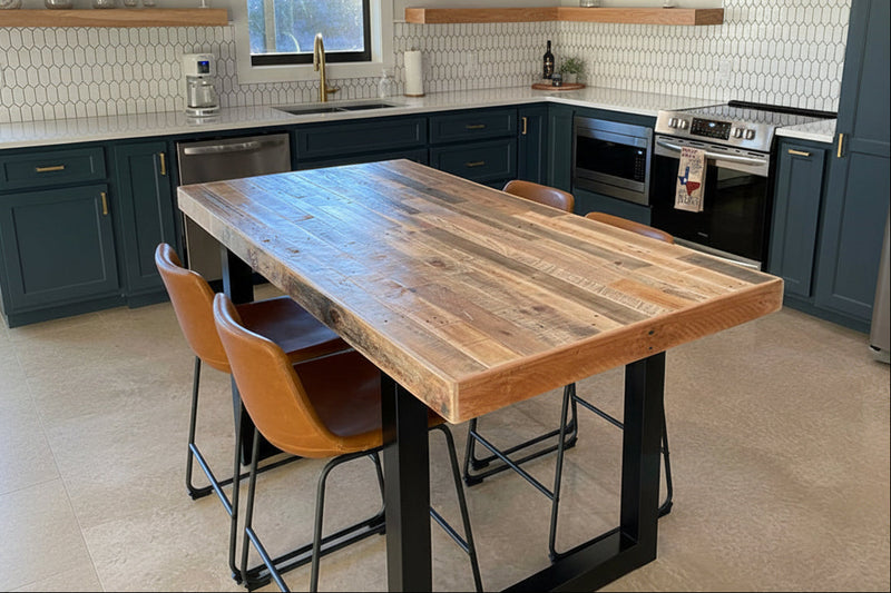 Modern kitchen with a wooden kitchen island dining table and chairs.