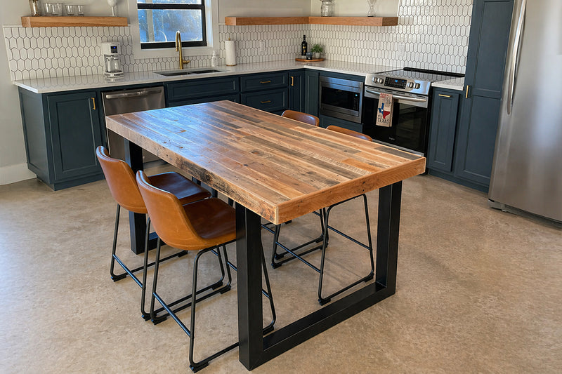 Modern kitchen with a wooden kitchen island dining table and chairs.