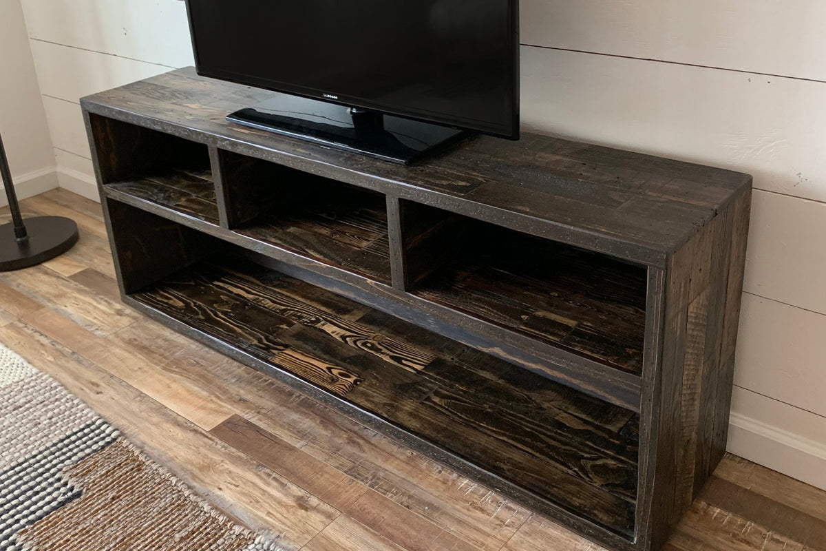Handcrafted reclaimed wood media console in a dark finish, with open shelving and cubby storage for any living room. Made in Arizona.