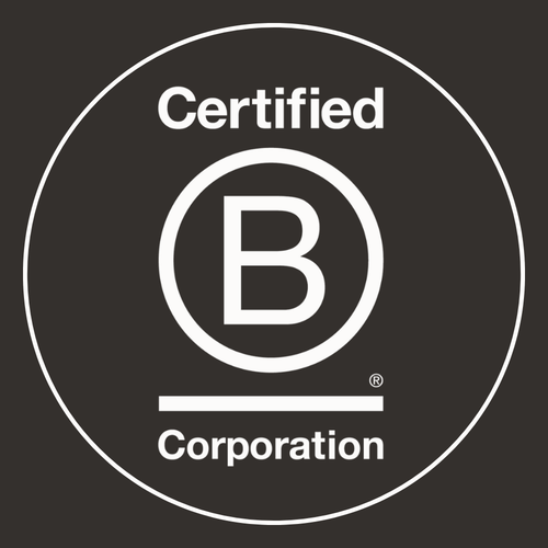 The Certified B Corporation logo appears in crisp white on a black background, featuring a bold “B” encircled, with “Certified” above and “Corporation” below—reflecting our values in sustainable, enduring reclaimed wood furniture.