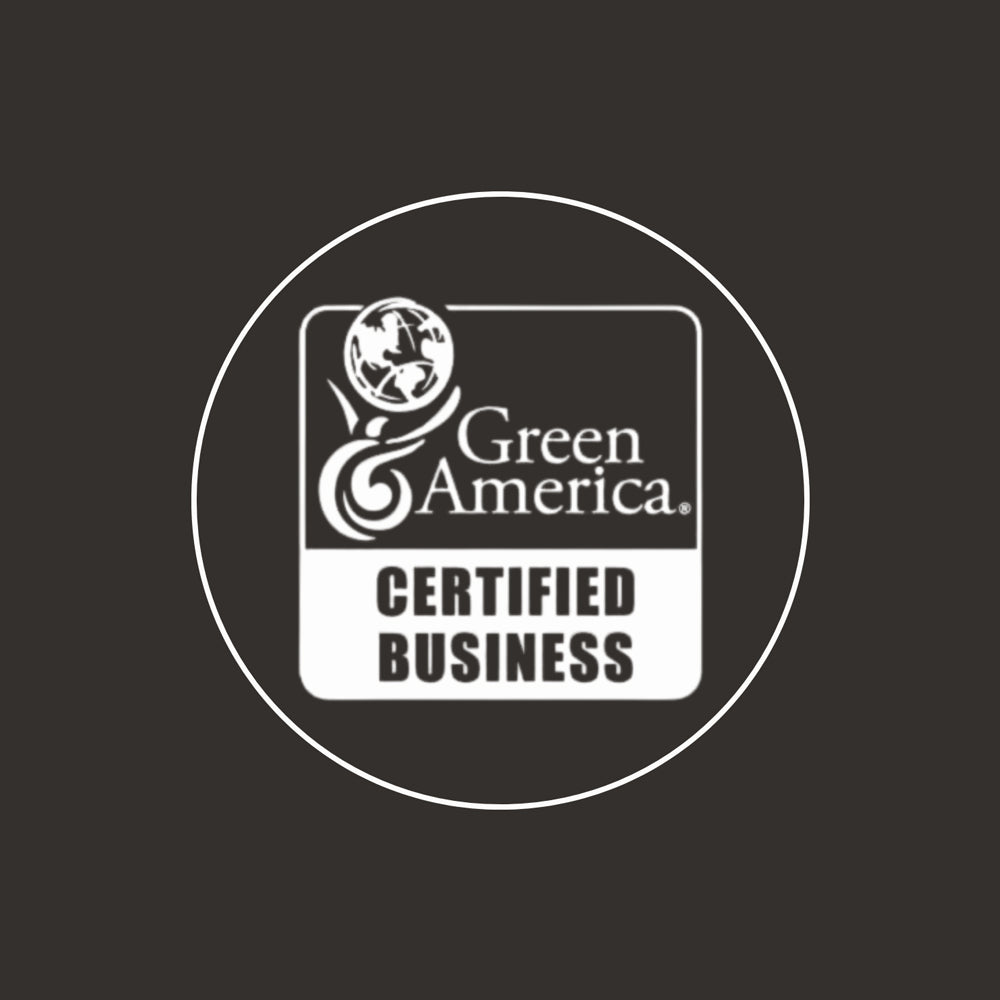 A black and white badge featuring the Green America logo and "Green America Certified Business" in a white circle on a dark background, underscoring our commitment to handcrafted reclaimed wood furniture and sustainable craftsmanship.