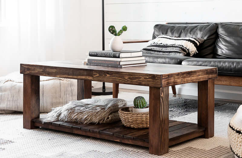 Handcrafted reclaimed wood coffee table with lower shelf, expertly crafted for enduring quality.