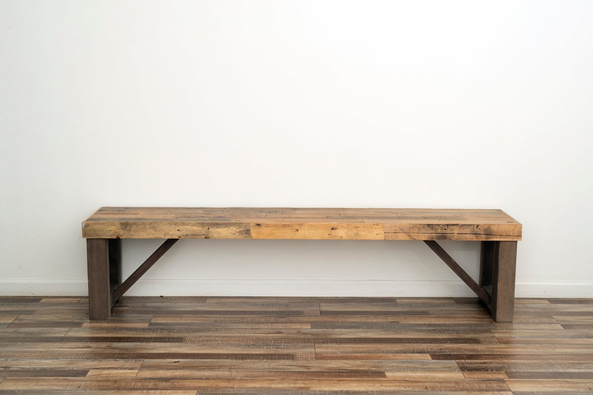 This handcrafted bench features beautifully reclaimed wood with a rustic finish, highlighting sustainable craftsmanship and enduring quality. Ideal as a narrow dining table or restaurant seating, crafted in Arizona for timeless appeal.