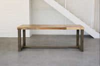 Expertly handcrafted in Arizona, this bar-height table features a sleek rectangular reclaimed wood top and robust legs, perfect as a kitchen island or restaurant table. Sustainable design meets enduring quality and timeless style.