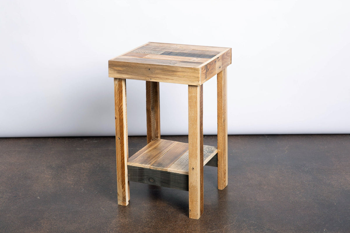 Expertly handcrafted in Arizona, this narrow side table features a square top and lower shelf, made from reclaimed wood with a rustic finish—an enduring piece of reclaimed wood furniture ideal for home or restaurant spaces.