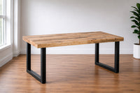 Reclaimed wood dining table with black metal legs in a room with a window and plant. Rustic, natural and modern. Sustainably made by Kase Custom in Arizona. 
