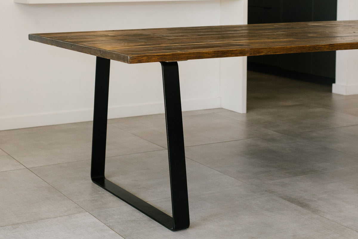 Experience timeless craftsmanship with our handcrafted Arizona reclaimed wood table, featuring a sustainable solid wood top and sturdy black steel legs—a perfect dining solution for modern, minimalist spaces.