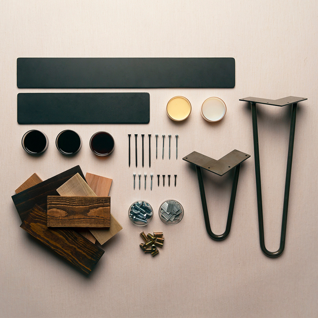Expertly organized hardware essentials—metal legs, reclaimed wood samples, and finishing products—highlight the craftsmanship behind our handcrafted-in-Arizona bar tables and reclaimed wood furniture collections.
