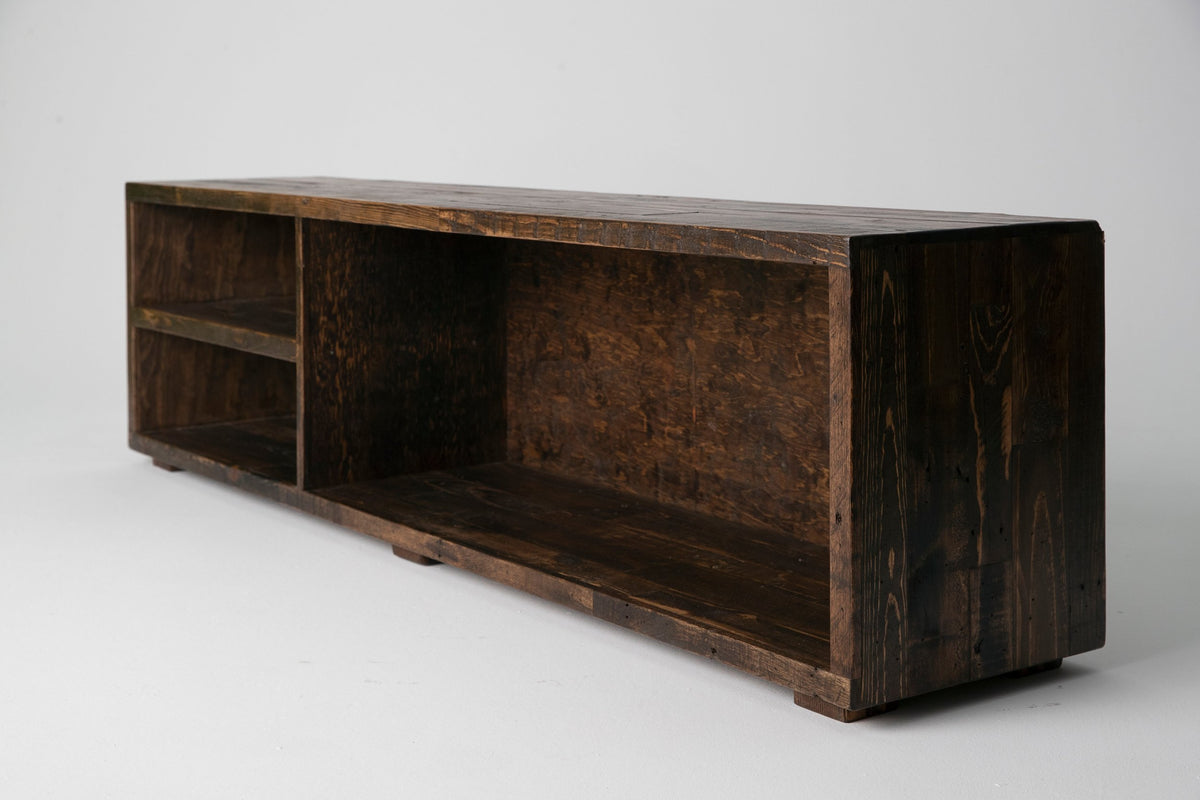 This handcrafted reclaimed wood console, made in Arizona, boasts a rustic dark-stained finish. The eco-friendly console features open shelving and spacious storage, perfect for sustainable reclaimed wood furniture lovers.