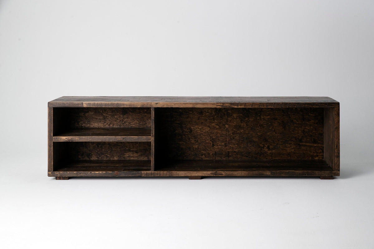 Handcrafted in Arizona, this reclaimed wood TV stand showcases enduring quality and sustainable craftsmanship. Its open design features two left-side shelves and a spacious right compartment.