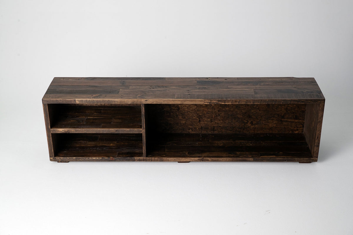 Expertly handcrafted in Arizona, this reclaimed wood TV stand highlights sustainable craftsmanship. Two open shelves and a larger side compartment offer stylish functionality.