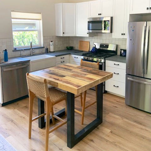 reclaimed wood kitchen island with steel legs in small home