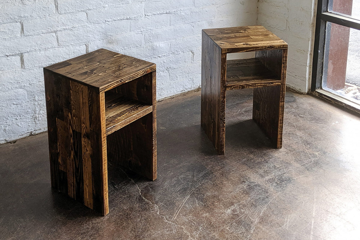 Handcrafted in Arizona, these rustic reclaimed wood side tables showcase premium craftsmanship and enduring quality. Each narrow table features organic textures, a sturdy shelf, and is perfect as reclaimed wood furniture.