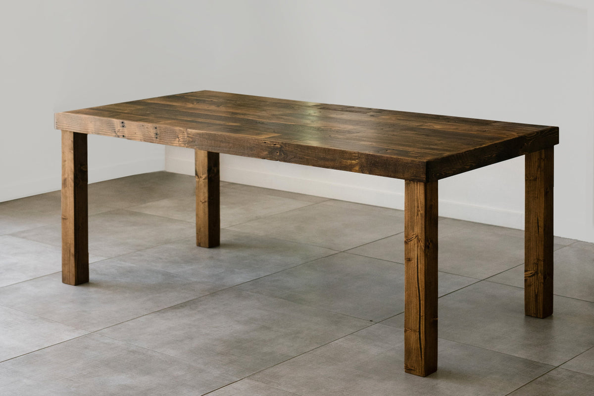 This handcrafted conference table, made in Arizona from rich, reclaimed wood with a dark finish and sturdy legs, brings enduring quality to any space—ideal as a dining table or restaurant table for sustainable design.